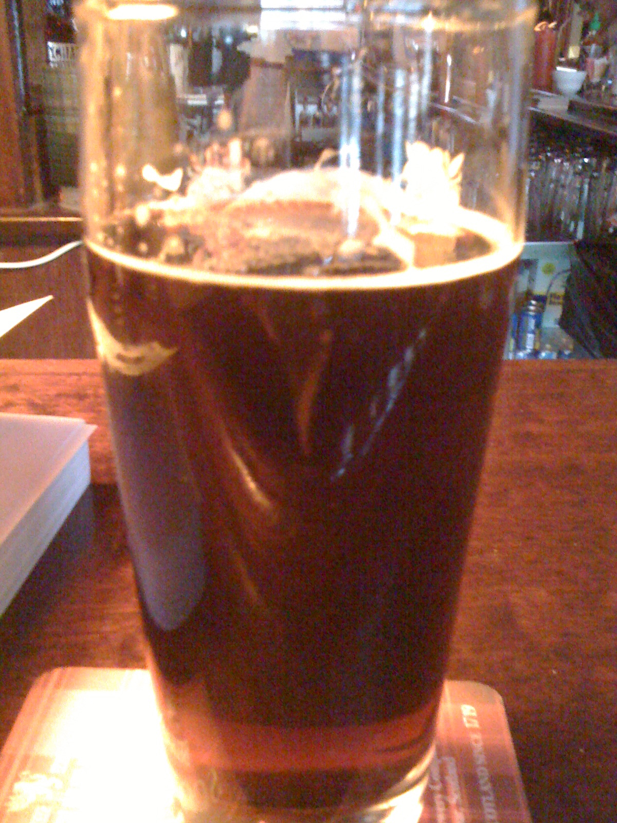 Dark craft beer in pint glass at NYC bar, circa 2010