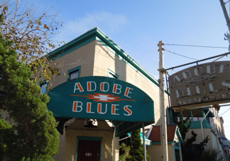 Adobe Blues bar storefront with green awning and signage, circa 2013