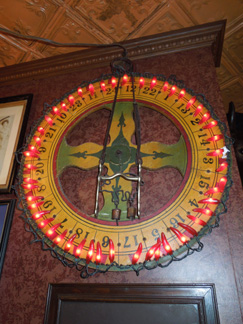 Ornate neon beer bottle sign illuminating Adobe Blues bar interior, circa 2012