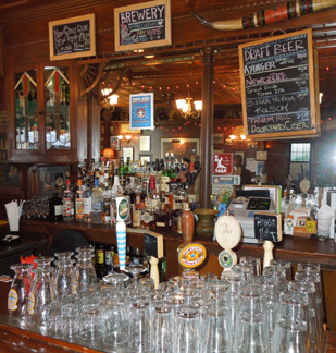 Adobe Blues bar interior with tap handles, glassware, and chalkboard menu, circa 2012