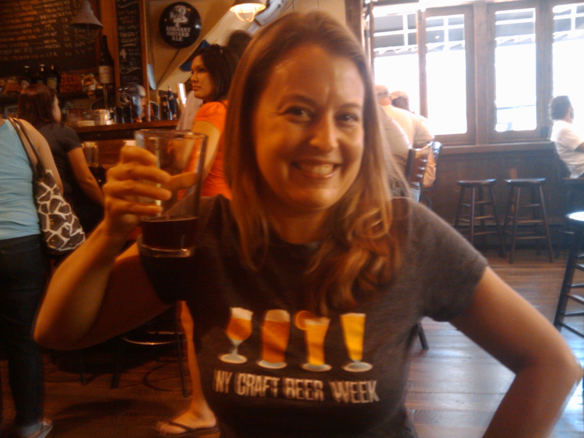 Rian McCormick at Blind Tiger Ale House wearing NYC Craft Beer Week shirt, holding a beer glass, circa 2010