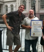 Dave Brodrick and Jimmy Carbone holding Mayor's Proclamation for Good Beer Month, July 2010
