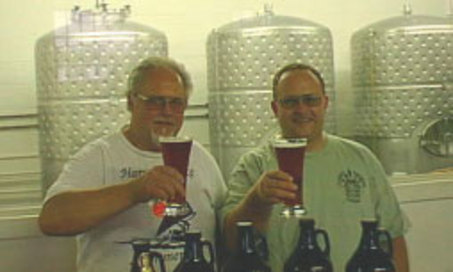Kurt and Dave Hoffman of Climax Brewing Company at brewery with fermentation tanks, circa 2010