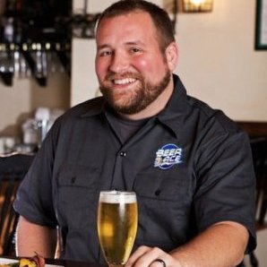 Nate Fochtman, VP Craft & Specialty at Ace Distributing, with beer glass at CBC 2013