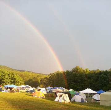 Double rainbow over Ommegang brewery campground with tents during Beer Culture and Travel Conference, August 2013
