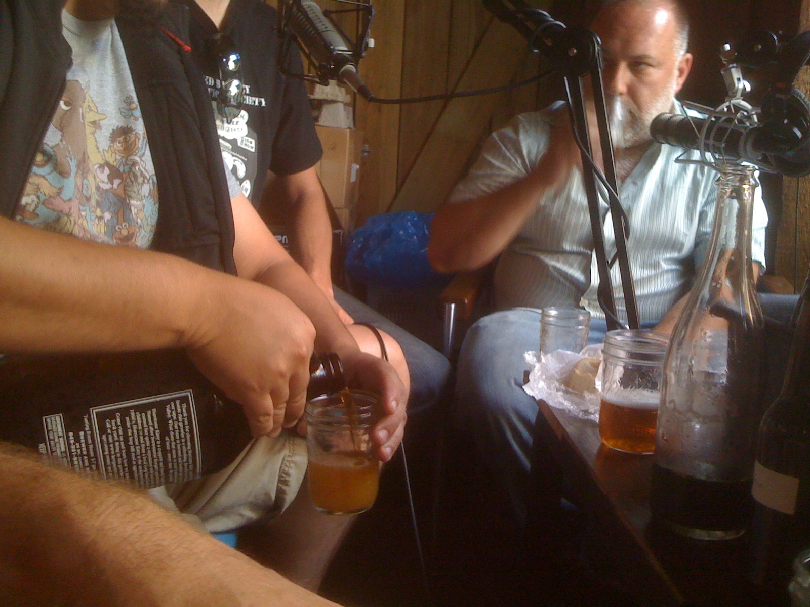 Beer Sessions Radio podcast recording with hosts and guests pouring craft beer, June 2010