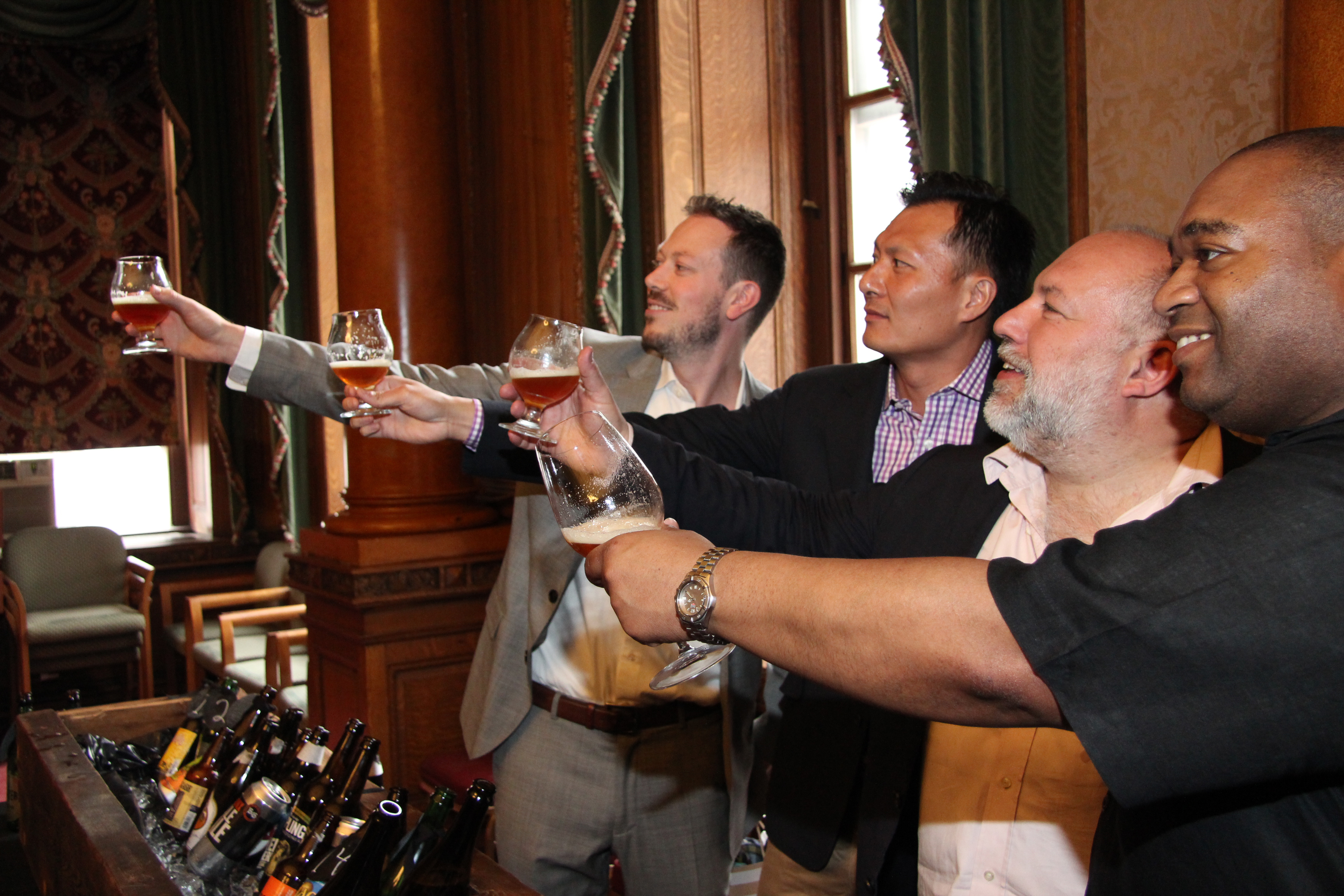 Brendan Woodcock, James Tai, Jimmy Carbone, and Michael Brooks toasting craft beers at Judgement of Brooklyn tasting, 2014