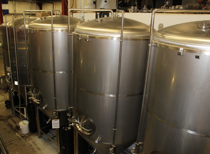 Stainless steel fermentation tanks in a brewery, circa 2012